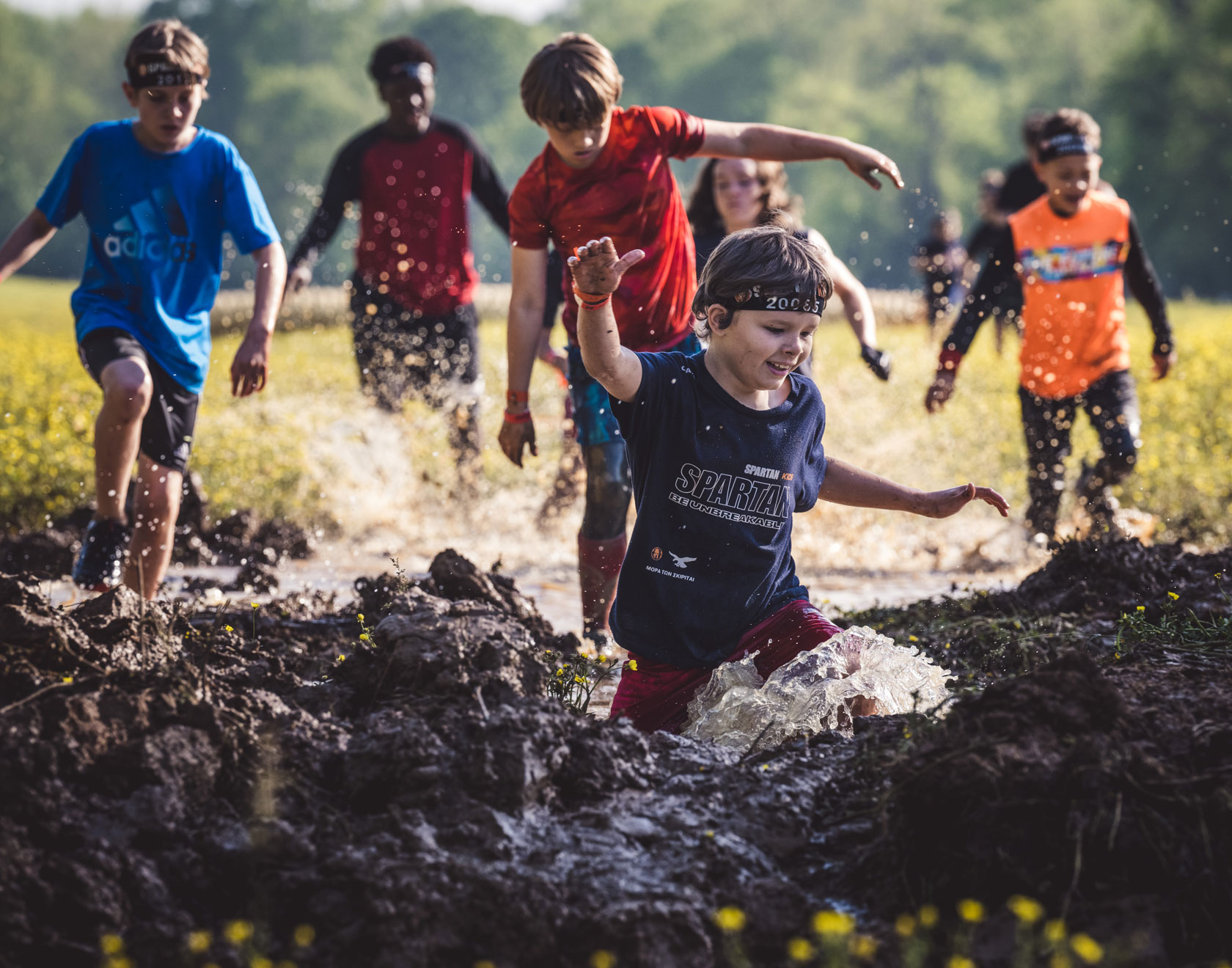 Kids walking through the mud